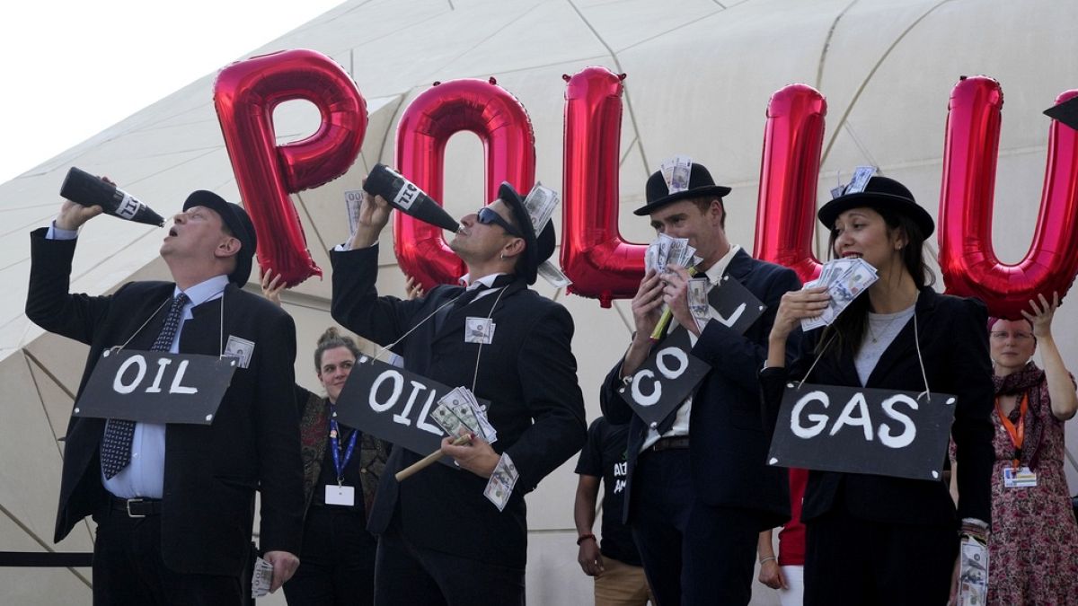 Activists protest against fossil fuels at the COP28 U.N. Climate Summit, Sunday, Dec. 10, 2023, in Dubai, United Arab Emirates.