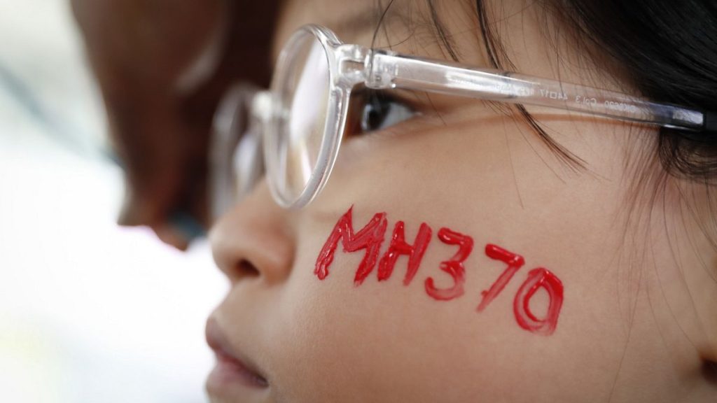 A girl has her face painted during a Day of Remembrance for MH370 event in Kuala Lumpur, Malaysia.