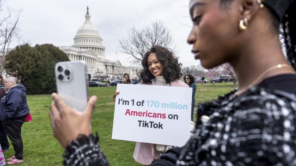 TikTok users monitor voting at the Capitol in Washington, as the House passed a bill that would lead to a nationwide ban of the popular video app.