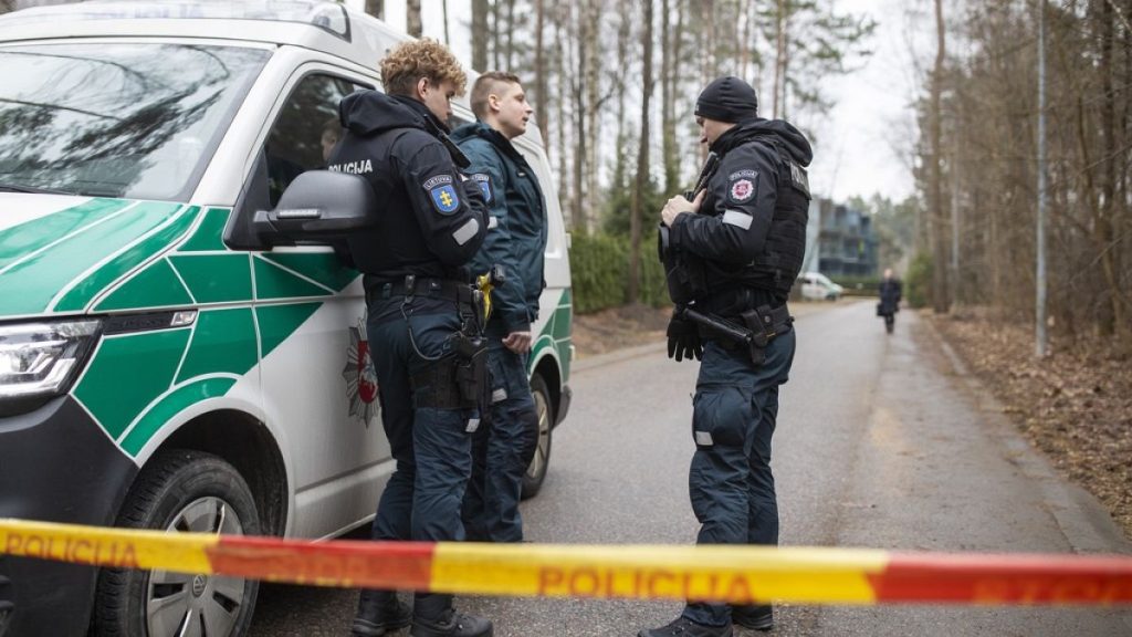 Police officers patrol near the house of Leonid Volkov, a close associate of the late Russian opposition leader Alexei Navalny, in Vilnius, Lithuania, Wednesday, March 13, 202