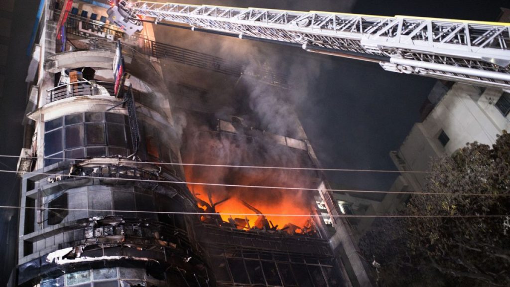 Firefighters work to contain a fire that broke out at a commercial complex in Dhaka, Bangladesh.