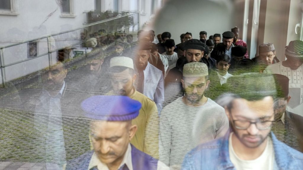 Muslims perform an Eid al-Fitr prayer, marking the end of the fasting month of Ramadan, in Berlin, Germany, Wednesday, April, 10, 2024.