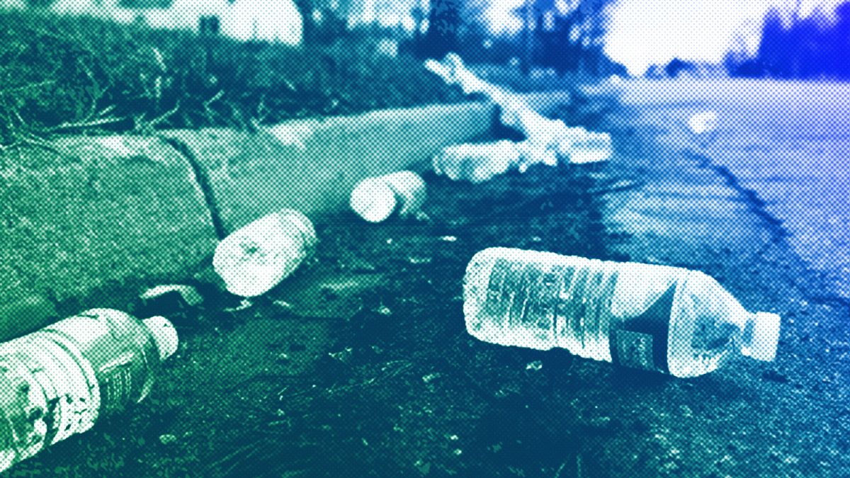 A broken case of water lays along the street near a water station in Flint, MI, February 2016