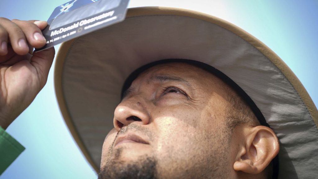 Fransisco Vielma, science and social studies director for Eagle Pass ISD, looks at the sun ahead of a total solar eclipse Monday, April 8, 2024.