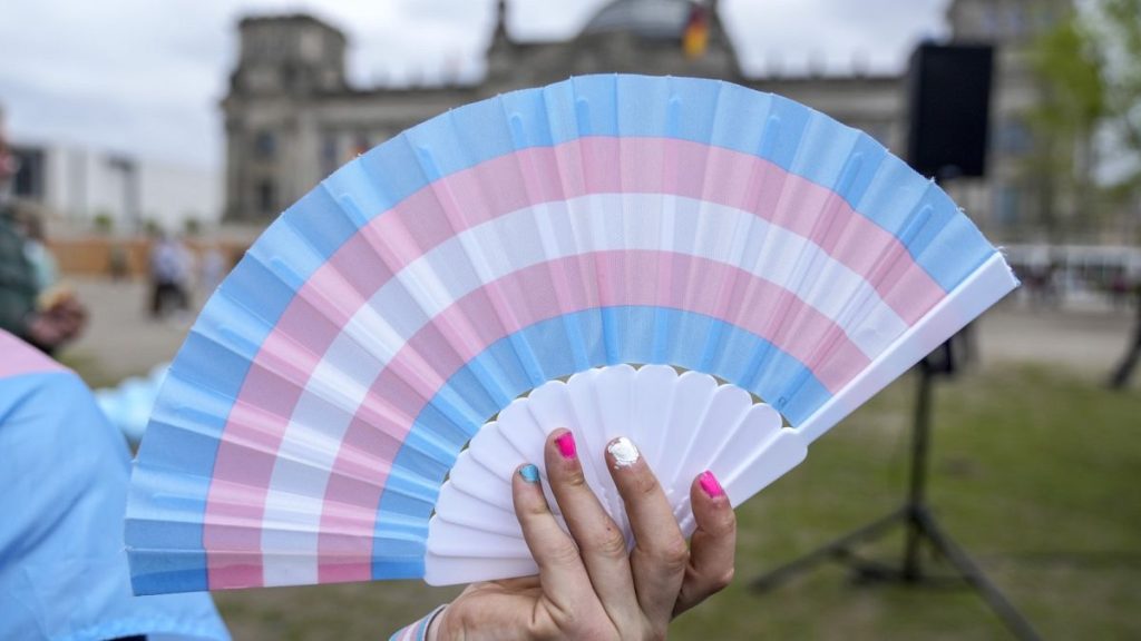 A blue, pink and white fan.