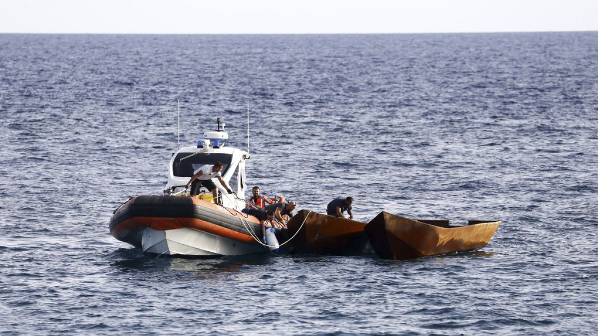 talian Coast Guard personnel prepare to tow boats used to carry migrants, near the port of the Sicilian island of Lampedusa, southern Italy