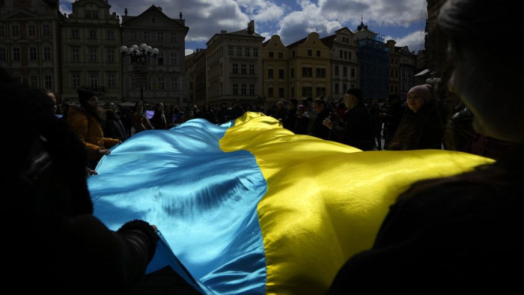 People wave with Ukrainian flag during a demonstration in support of Estonian military strategic plan for Ukraine, Czech Republic, April 21, 2024.