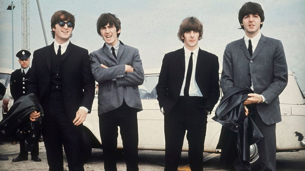 The Beatles, from left, John Lennon, George Harrison, Ringo Starr and Paul McCartney arrive in Liverpool, England on July 10, 1964