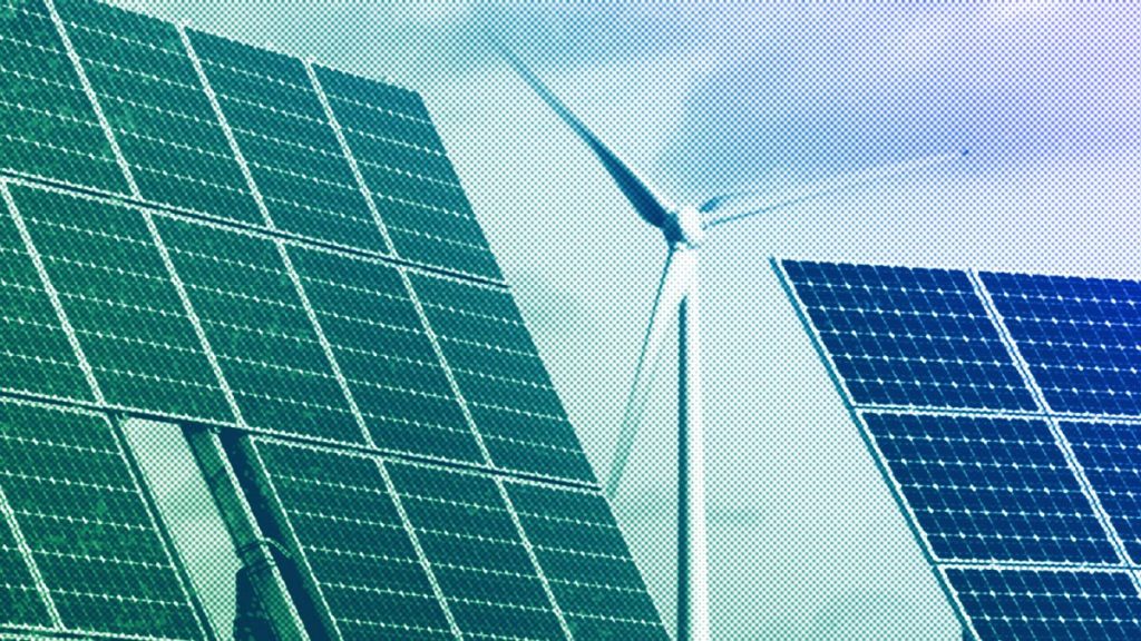 Photovoltaic modules and a windmill of the wind farm are pictured at the village of Feldheim near Berlin, November 2011