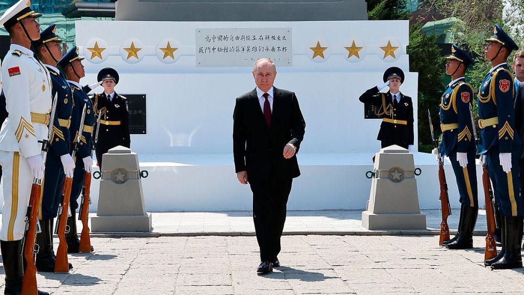 Russian President Vladimir Putin attends a laying flowers ceremony at the Monument to the Soviet soldiers who died in the battles for the liberation of China