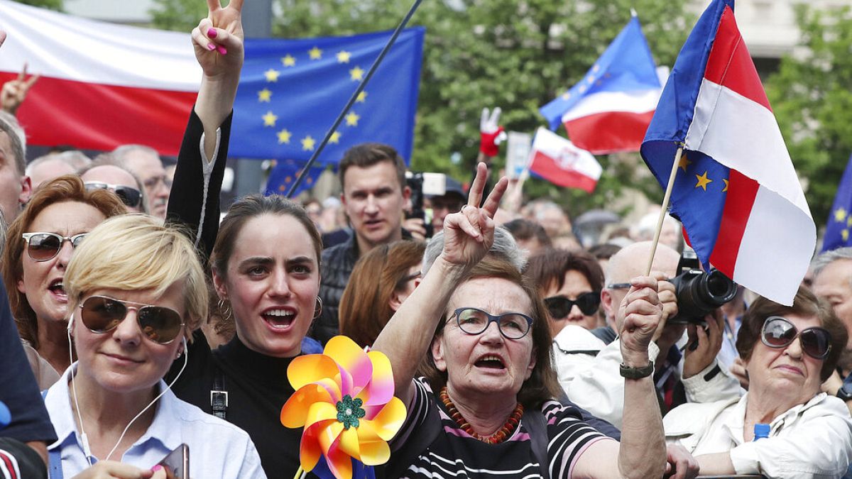 Thousands of Poles with pro-European banners march to celebrate Poland
