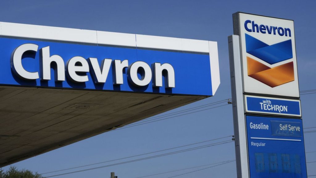 Chevron logos are displayed at a gas station in Columbus, Miss., Monday, Oct. 23, 2023.