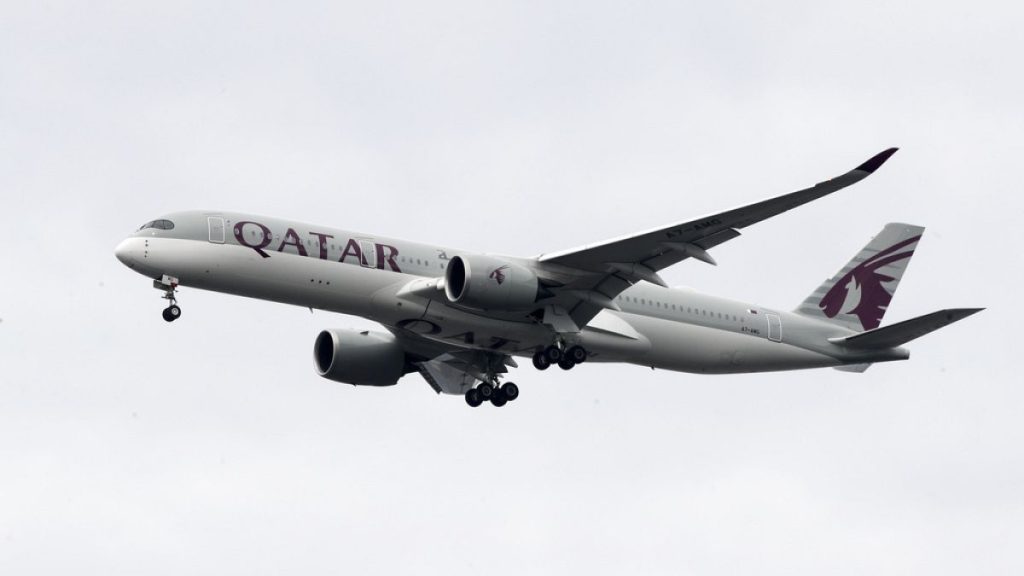 FILE - In this Nov. 7, 2019, file photo, a Qatar Airways jet approaches Philadelphia International Airport in Philadelphia.