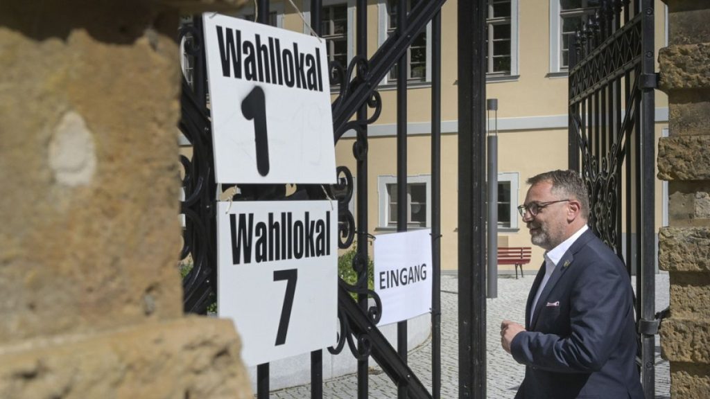 Julian Vonarb, Lord Mayor of Gera, comes to cast his vote for Thuringia local elections, at a polling station in Gera, germany, Sunday, May 26, 2024.