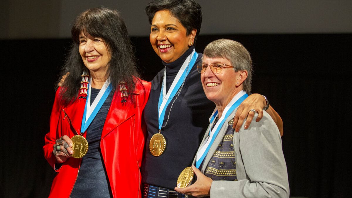 Joy Harjo, Indra Nooyi, and Rebecca Halstead take a picture together after being inducted into the National Women