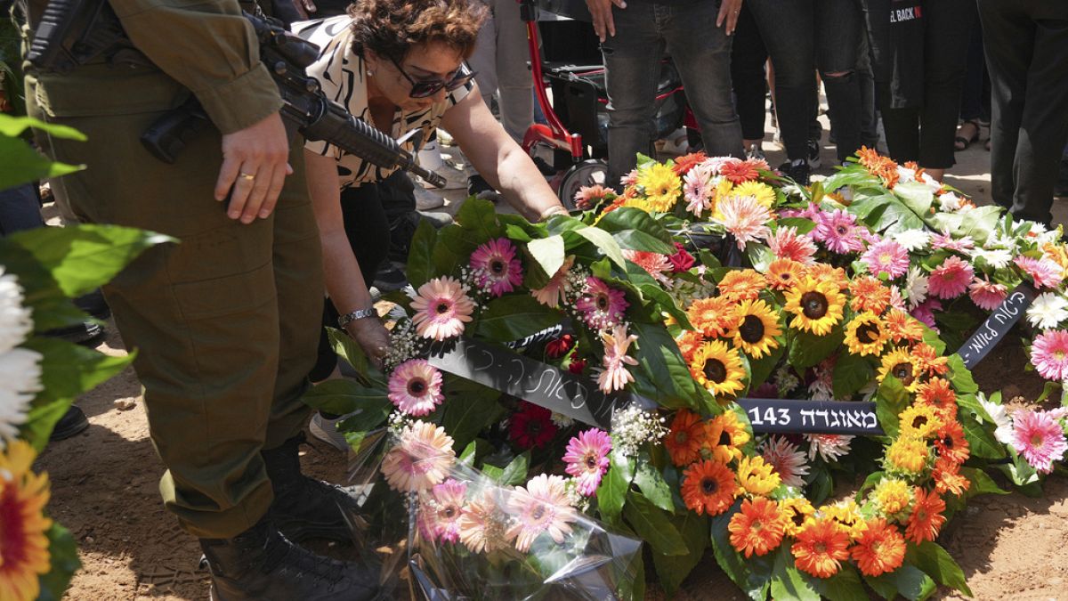 Mourners attend the funeral of Michel Nisenbaum, who was killed during Hamas