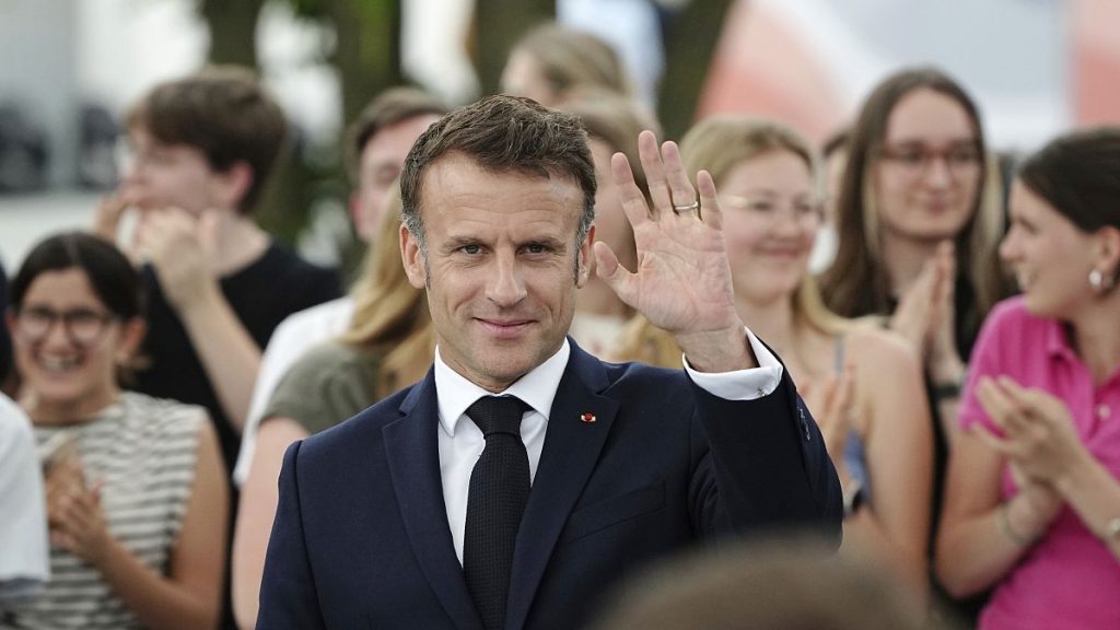 French President Emmanuel Macron waves as he visits the democracy festival to mark the 75th anniversary, near Berlin, ahead of their three-day state visit to Germany, 26/05/24