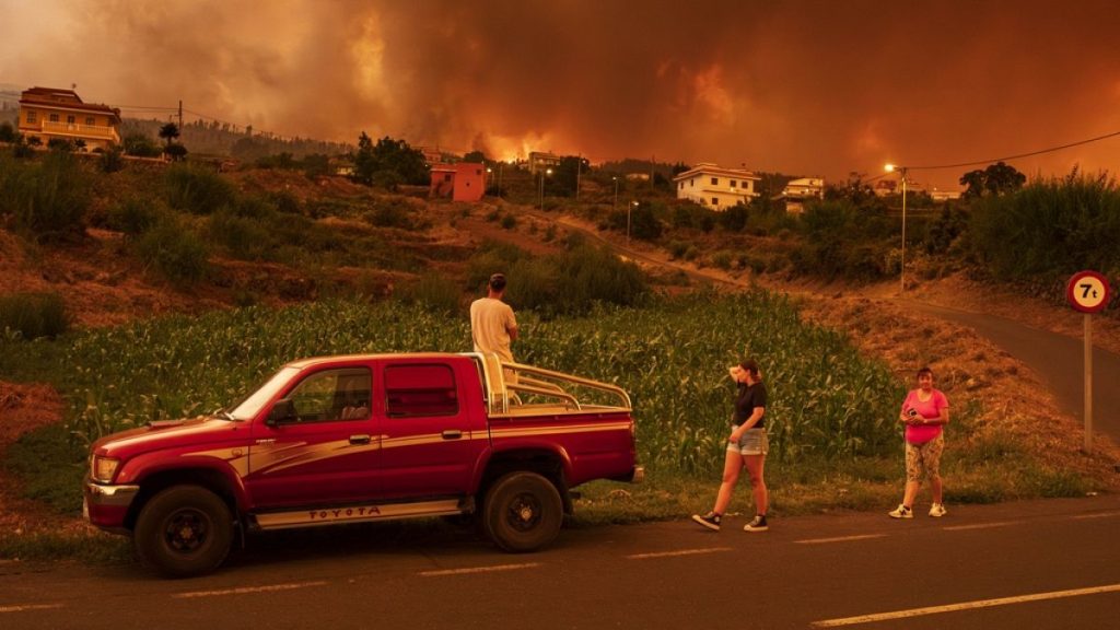 Residents try to reach their houses in Benijos village as a wildfire advances in La Orotava in Tenerife, Canary Islands, Spain in August 2023