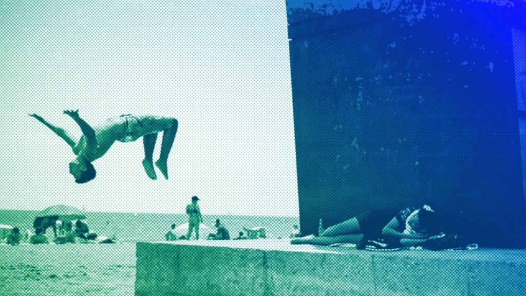 A boy does a back flip at Barcelona