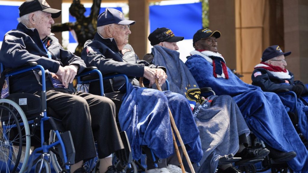 World War II veterans listen during a ceremony to mark the 80th anniversary of D-Day, Thursday, June 6, 2024, in Normandy.