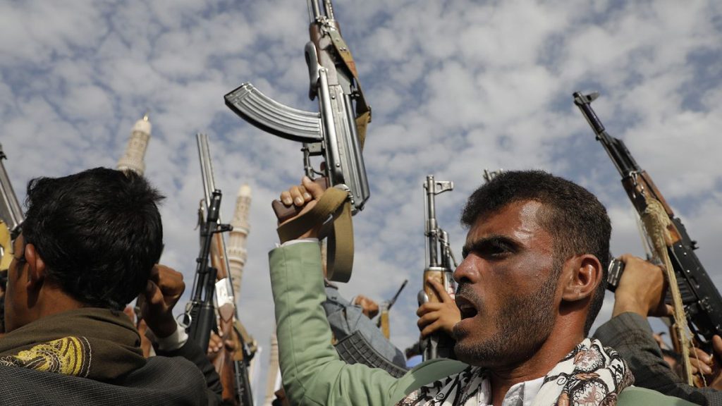 Houthi supporters shout slogans as they raise machine-guns and during a rally against the U.S.-led strikes against Yemen in Sanaa, 17 May 2024