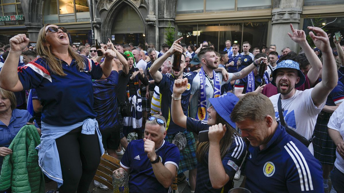 Scotland fans sing on Marienplatz square next to the town hall in Munich, June 13, 2024