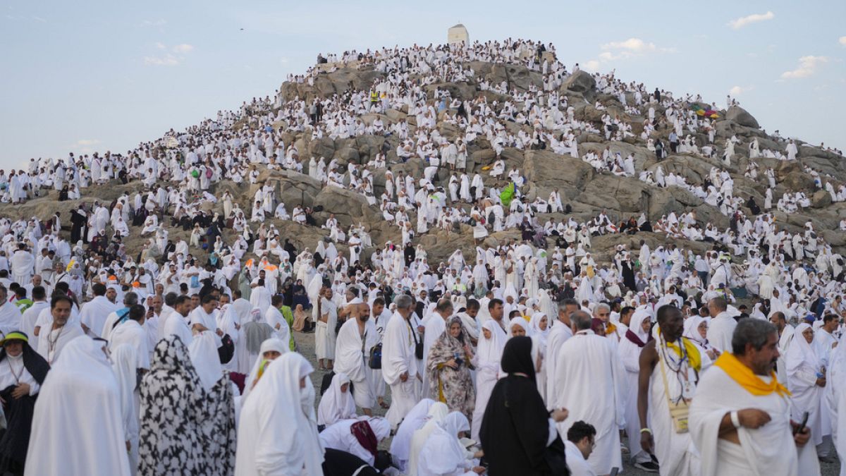 Muslim pilgrims gather at top of Mountain of Mercy, on the Plain of Arafat, near Mecca, Saudi Arabia, Saturday, June 15, 2024