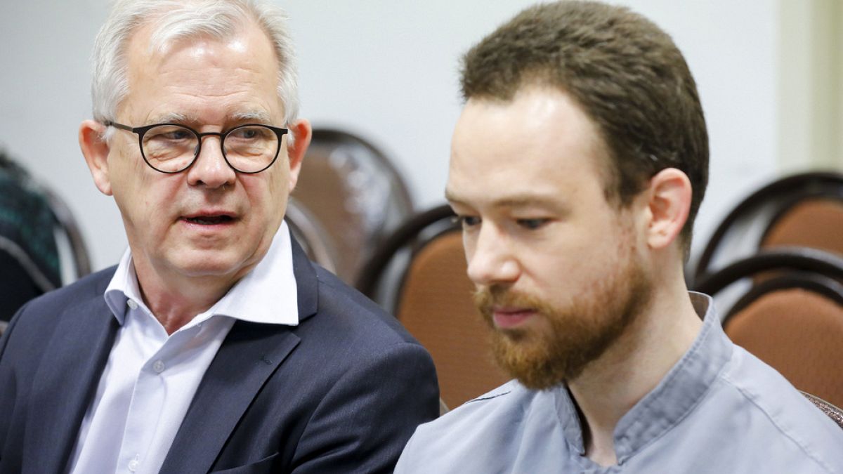 Head of Mission of the Embassy of Sweden in Tehran Lars Ronnås with Swedish citizen Johan Floderus in a courtroom at the Revolutionary Court in Tehran, Iran. Dec. 20, 2023