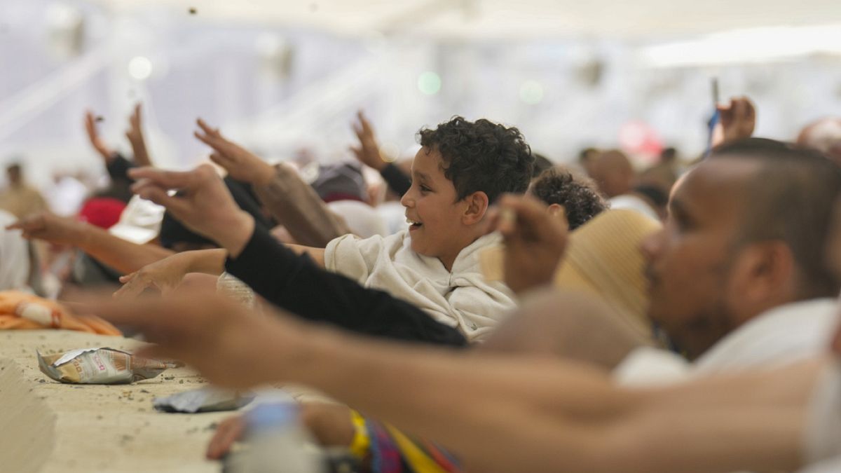 Muslim pilgrims cast stones at pillars in the symbolic stoning of the devil, the last rite of the annual hajj, in Mina, near city of Mecca, Saudi Arabia, June 16th 2024