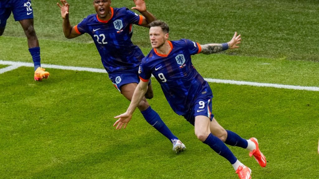 Wout Weghorst of the Netherlands celebrates his goal with his team mates during a Group D match between Poland and the Netherlands at the Euro 2024. Sunday, June 16, 2024