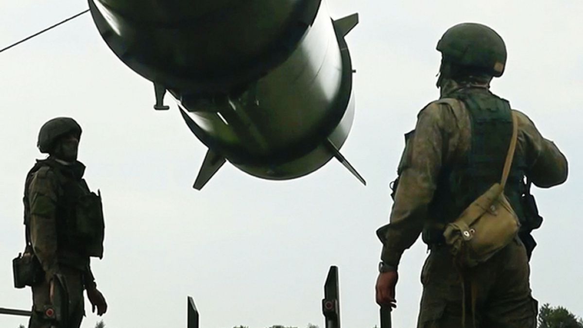 Russian soldiers load a Iskander-M short-range ballistic missile launchers at a firing position as part of Russian military drill intended to train the troops.