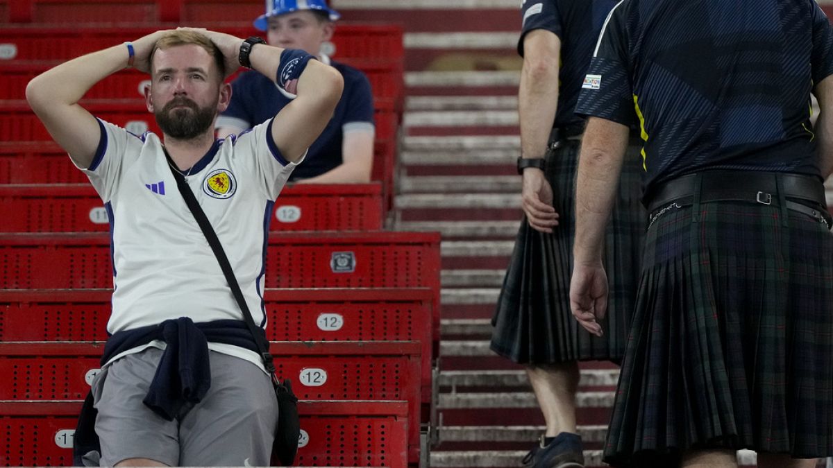 Scotland fans dejected as their team are knocked out of Euro 2024 following a defeat against Hungary