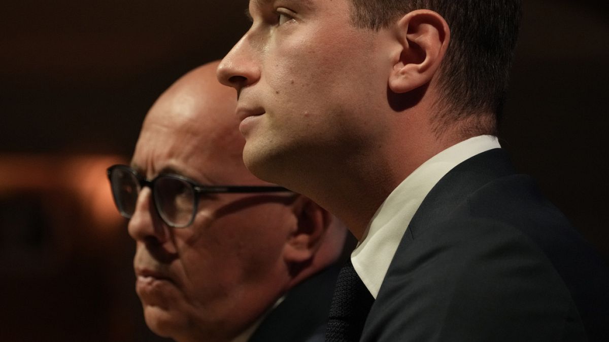 Eric Ciotti, left, President of the conservative party Les Republicains, and far-right National Rally party president Jordan Bardella attend a meeting with the French business