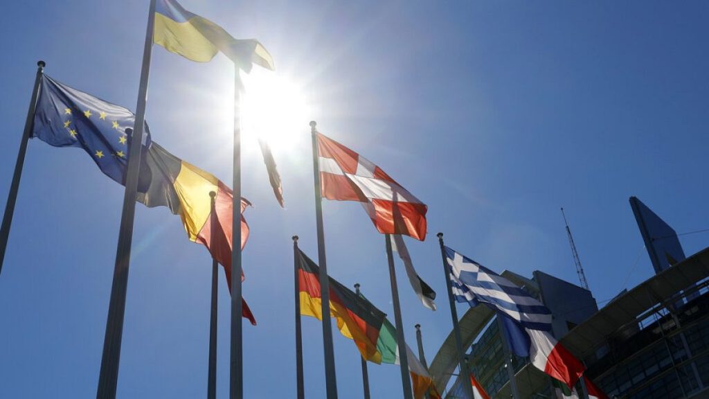 The Ukrainian flag, top, flies with others European flags outside the European Parliament ,in Strasbourg, France