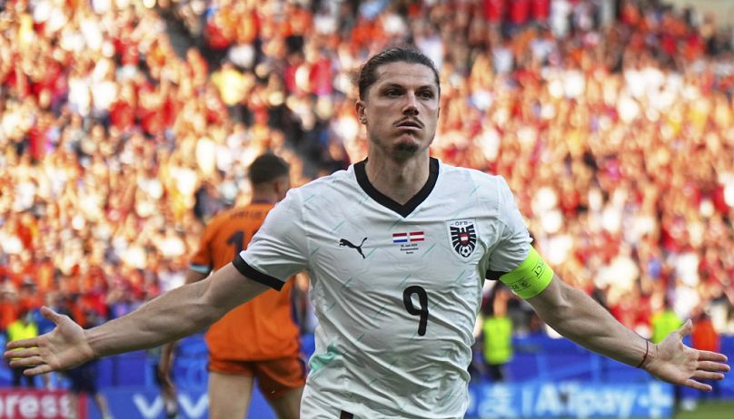 L'Autrichien Marcel Sabitzer célèbre après avoir marqué le troisième but de son équipe lors d'un match du groupe D entre les Pays-Bas et l'Autriche à l'Euro 2024