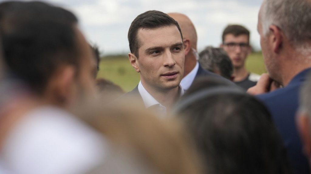 Far-right National Rally leader Jordan Bardella meets farmers as he visits a farm in Chuelles, 137 kms (85 miles) south of Paris, 14 June 2024