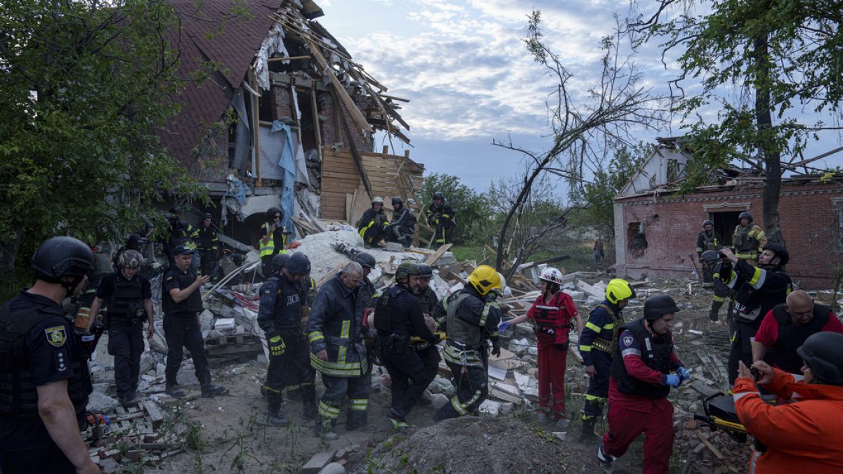 Ukrainian first responders at the scene of a Russian air strike.