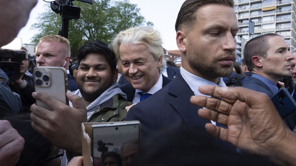 Anti-islam lawmaker Geert Wilders of the PVV, or Party for Freedom, is surrounded by body guards as he arrives to cast his ballot for the European election in The Hague, NL.