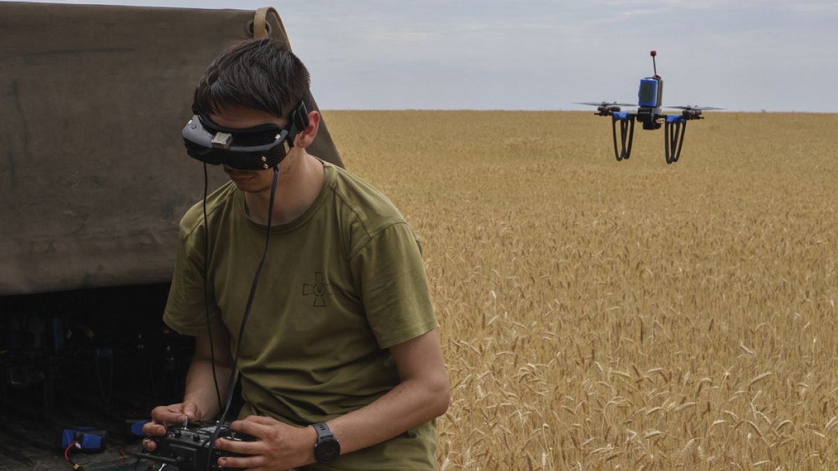 A Ukrainian serviceman of the Sky Hunters unit of the 65-th brigade operates a drone on the front line in Zaporizhzhia region, Ukraine, Friday, June 14, 2024.