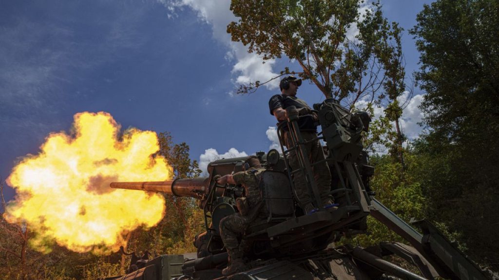 Ukrainian soldiers, of 43rd artillery brigade, fire by 2s7 self-propelled howitzer towards Russian positions at the frontline in Donetsk, Ukraine, Monday, June 24, 2024.