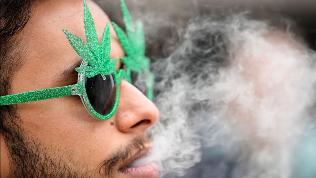 A German citizen is seen smoking cannabis in front of Cologne Cathedral, Monday 1 April 2024