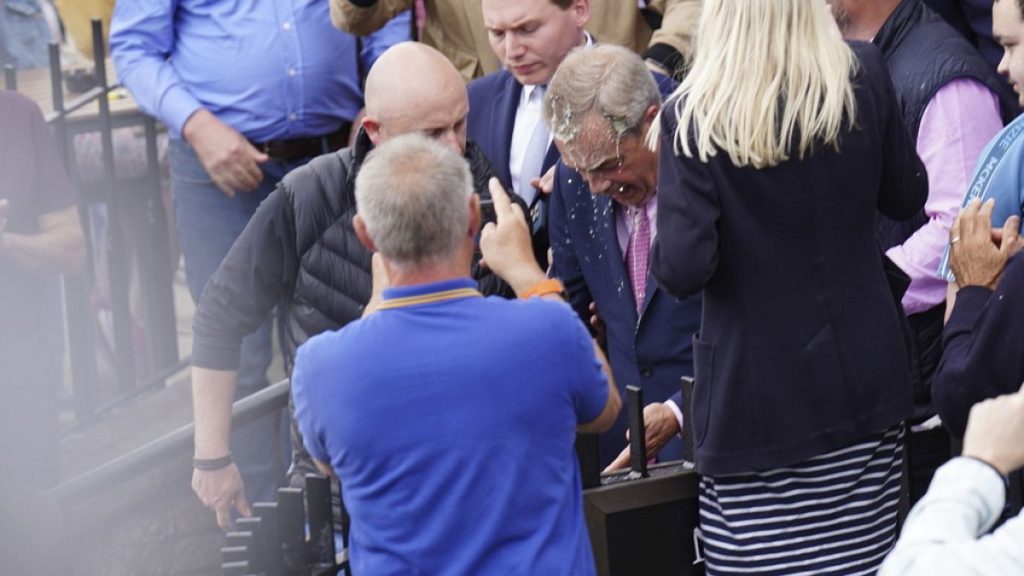 Reform UK leader, Nigel Farage, doused with a drink