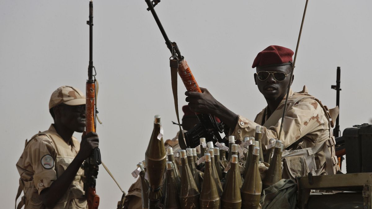 FILE - Sudanese soldiers from the Rapid Support Forces unit, led by Gen. Mohammed Hamdan Dagalo, the deputy head of the military council, secure the area where Dagalo attends