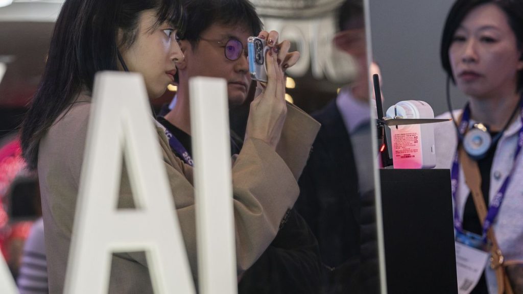 Visitors test products at the SK Telecom stand during the third day of the Mobile World Congress 2024 in Barcelona, Spain.