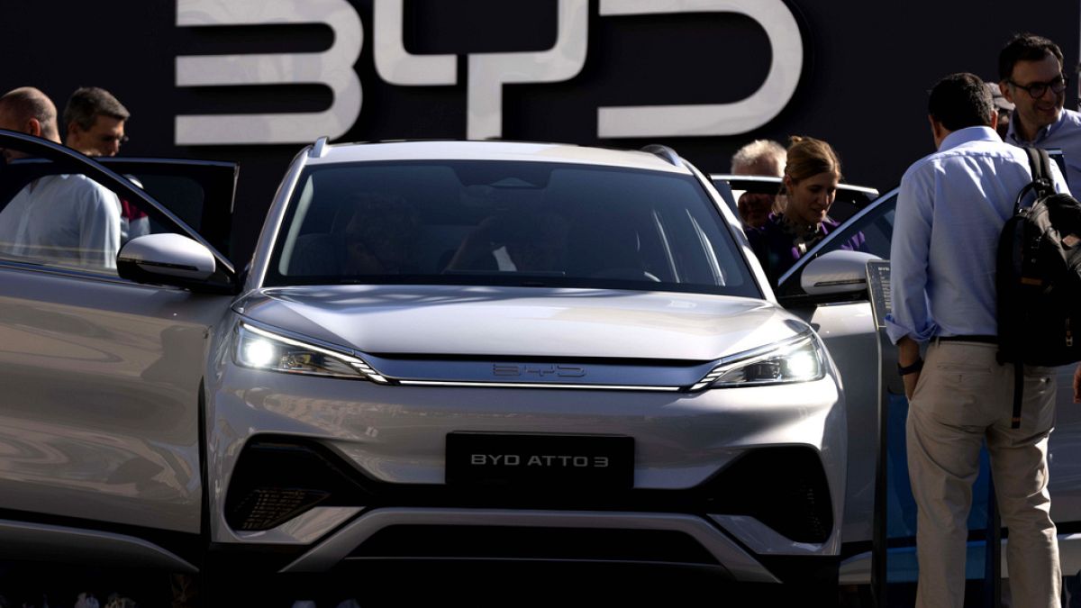 Visitors check the China made BYD ATTO 3 at the IAA motor show in Munich, Germany.