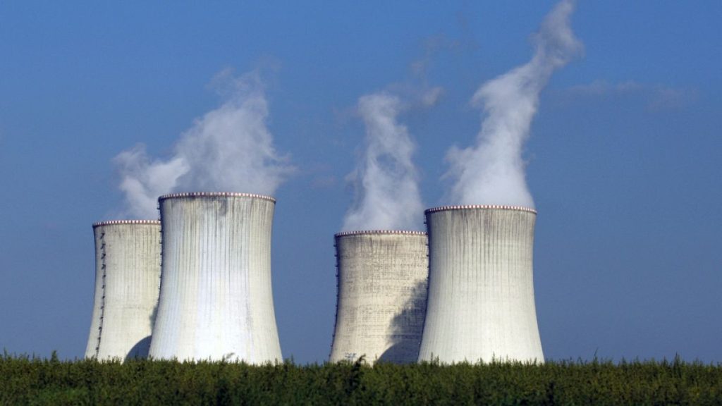 Four of the cooling towers of the Dukovany nuclear power plant rise high above the natural surroundings of Dukovany, Czech Republic.