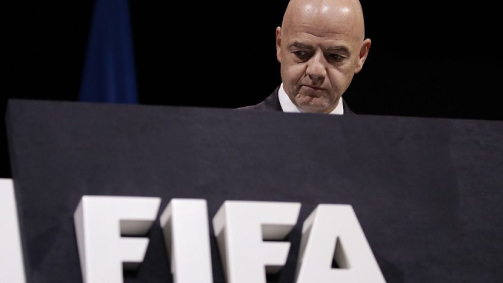 FIFA President Gianni Infantino walks on the stage before the start of the 69th FIFA congress in Paris, Wednesday, June 5, 2019