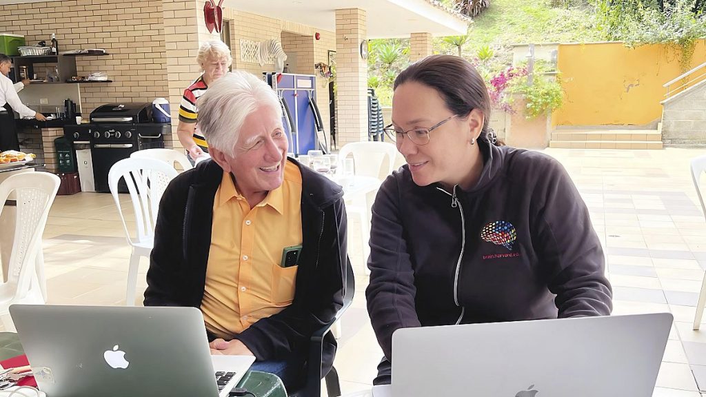 Dr Francisco Lopera, left, of the University of Antioquia, a neurologist, confers with fellow researcher Yakeel Quiroz of Massachusetts General Hospital.