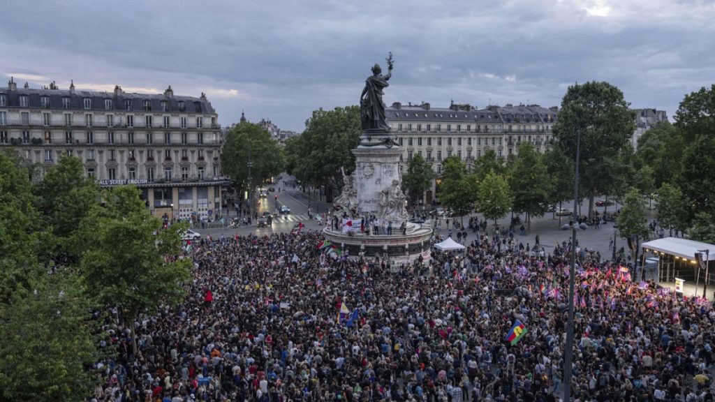 People gather at Republique square to protest the far-right National Rally, which came out strongly ahead in first-round legislative elections, Sunday, June 30, 2024 in Paris.