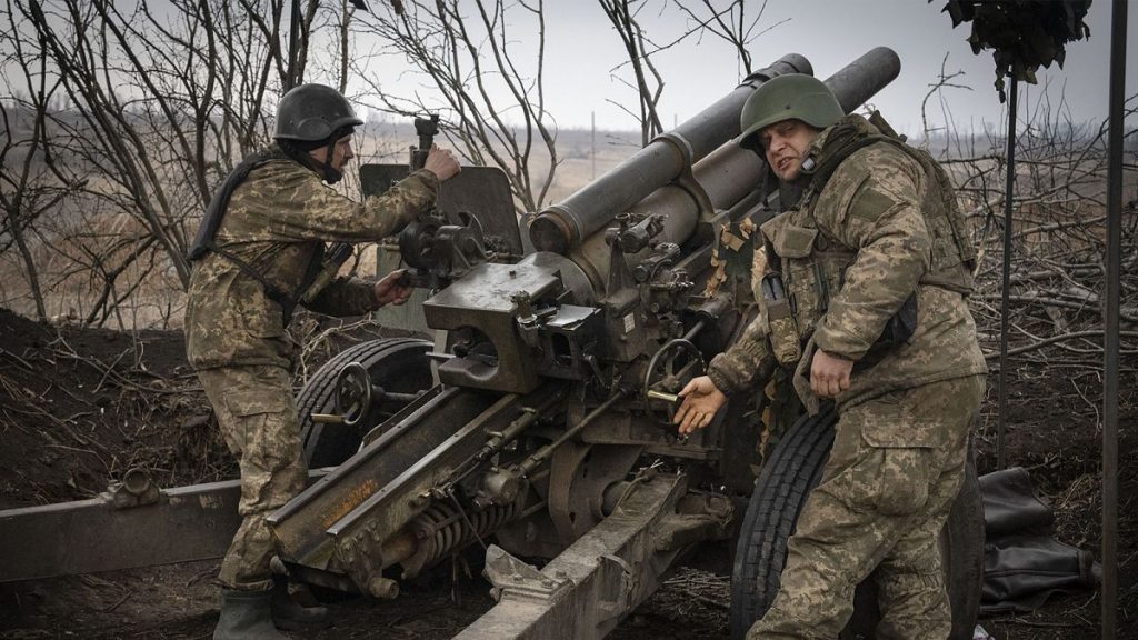 Ukrainian soldiers of the 71st Jaeger Brigade fire a M101 howitzer towards Russian positions at the frontline, near Avdiivka, Donetsk region, 22 March 2024